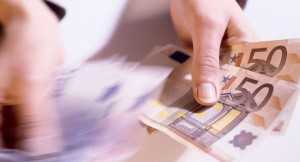 Hands counting 50 Euro notes  50 movement blur. Picture: Imagestate