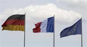 Flags of Germany, France and the European Union flutter in the wind before the meeting of new French President Hollande and German Chancellor Merkel in Berlin