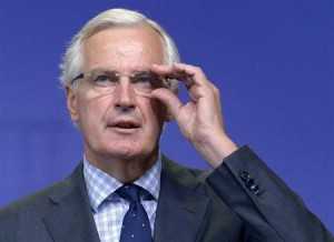 EU Commissioner in charge of regulation Barnier speaks at news conference in Brussels