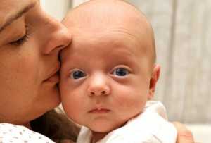 getty_rf_photo_of_woman_with_newborn_baby