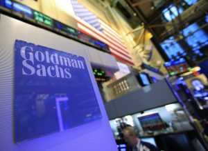 A Goldman Sachs sign is seen on at the company's post on the floor of the New York Stock Exchange