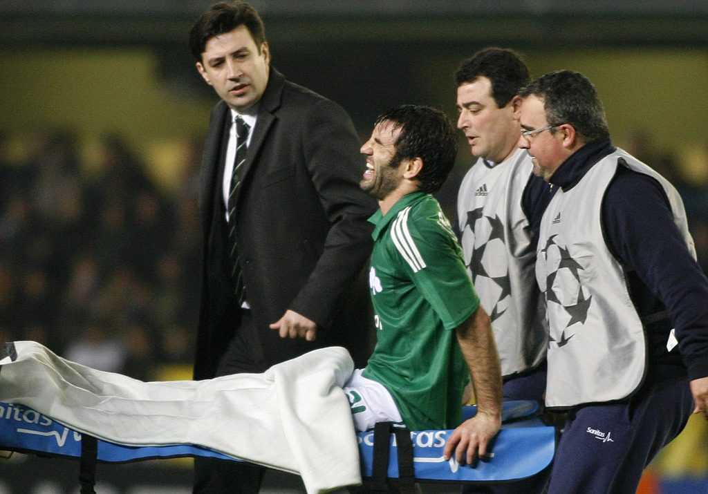 Panathinaikos' Karagounis is carried on a stretcher during their Champions League soccer match against Villarreal