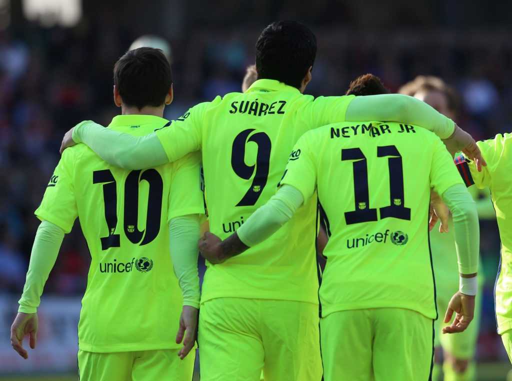 Barcelona's Suarez is congratulated by teammates after scoring a goal against Granada during their Spanish first division soccer match in Granada